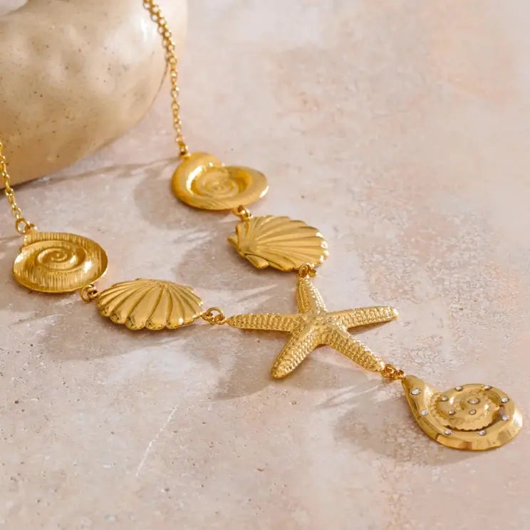 Woman wearing beach vibe necklace with starfish charm